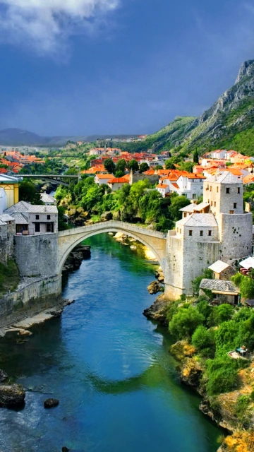 Old Stone Bridge Over River in Town