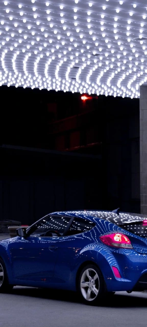 Blue Car Under Ceiling Lights