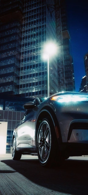 Car in Front of Illuminated Building