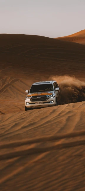 Toyota SUV Driving on Sand Dunes