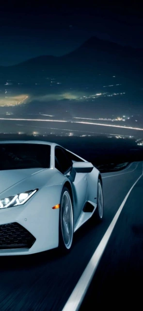 White Sports Car Driving at Night