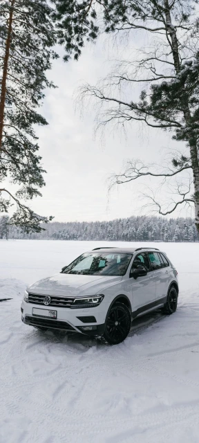 White Volkswagen SUV in Snow