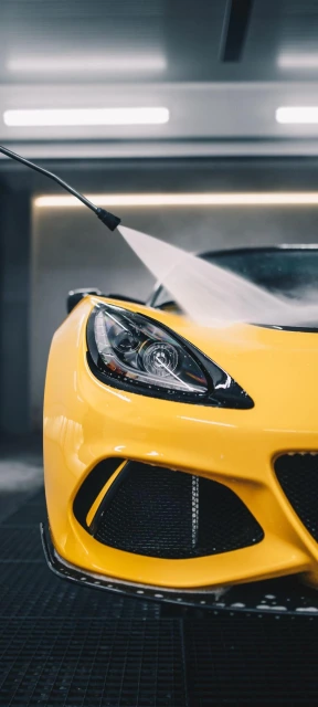 Yellow Sports Car Being Washed