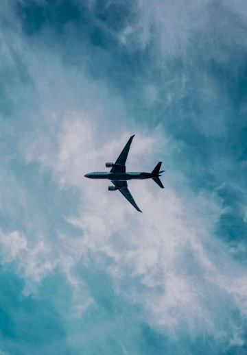 Airplane Flying in Dark Clouds